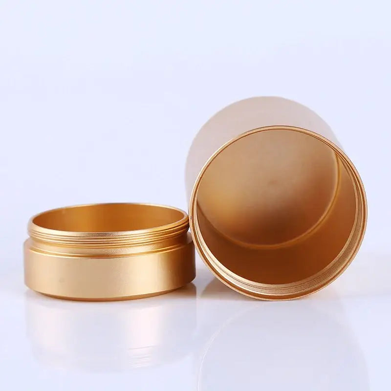 Stainless steel tea canister with airtight lid open, showing interior depth