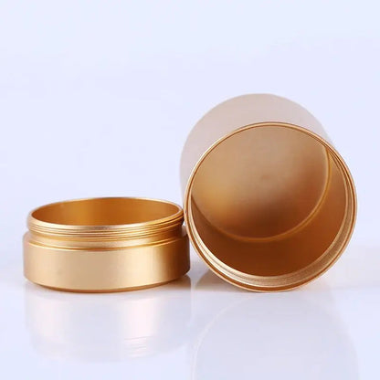Stainless steel tea canister with airtight lid open, showing interior depth