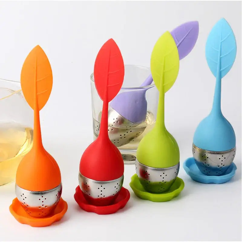 Leaf shaped tea infuser resting on a mug of hot tea