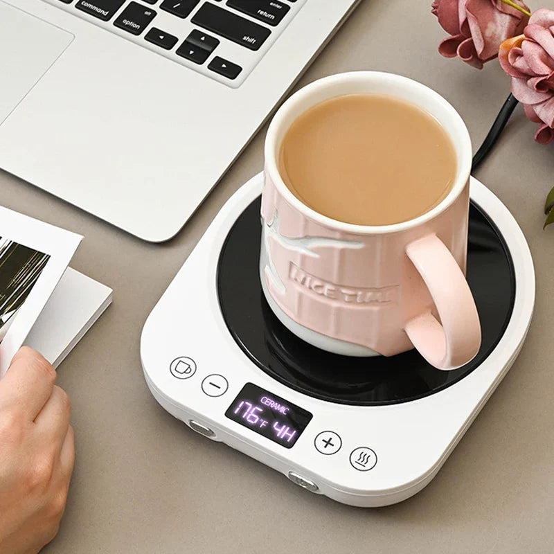 Black LED mug warmer with ceramic mug on desk, LED display visible