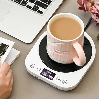 Black LED mug warmer with ceramic mug on desk, LED display visible