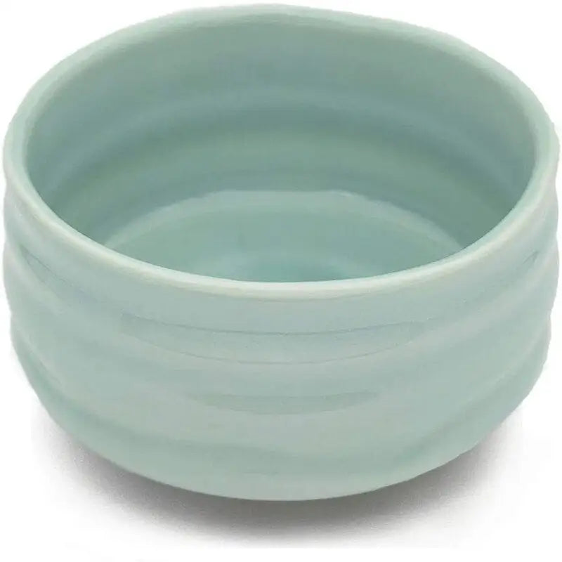 Light blue chawan tea bowl with matcha whisk