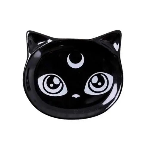 Sailor Moon tea cup resting on matching black ceramic saucer