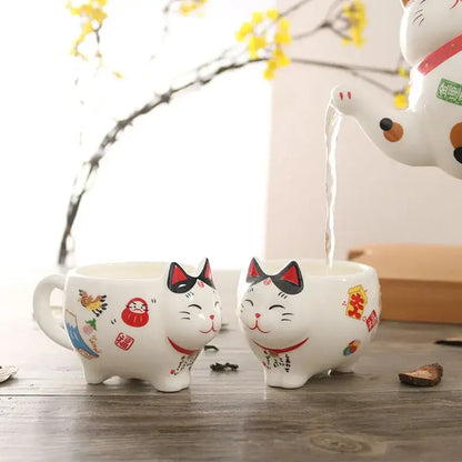 Hand-painted Maneki-Neko beckoning cat design on porcelain teapot