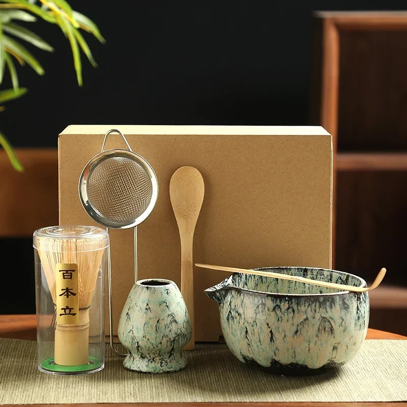 Matcha tea set in Jade Mist glaze: green ceramic bowl with bamboo whisk on linen cloth