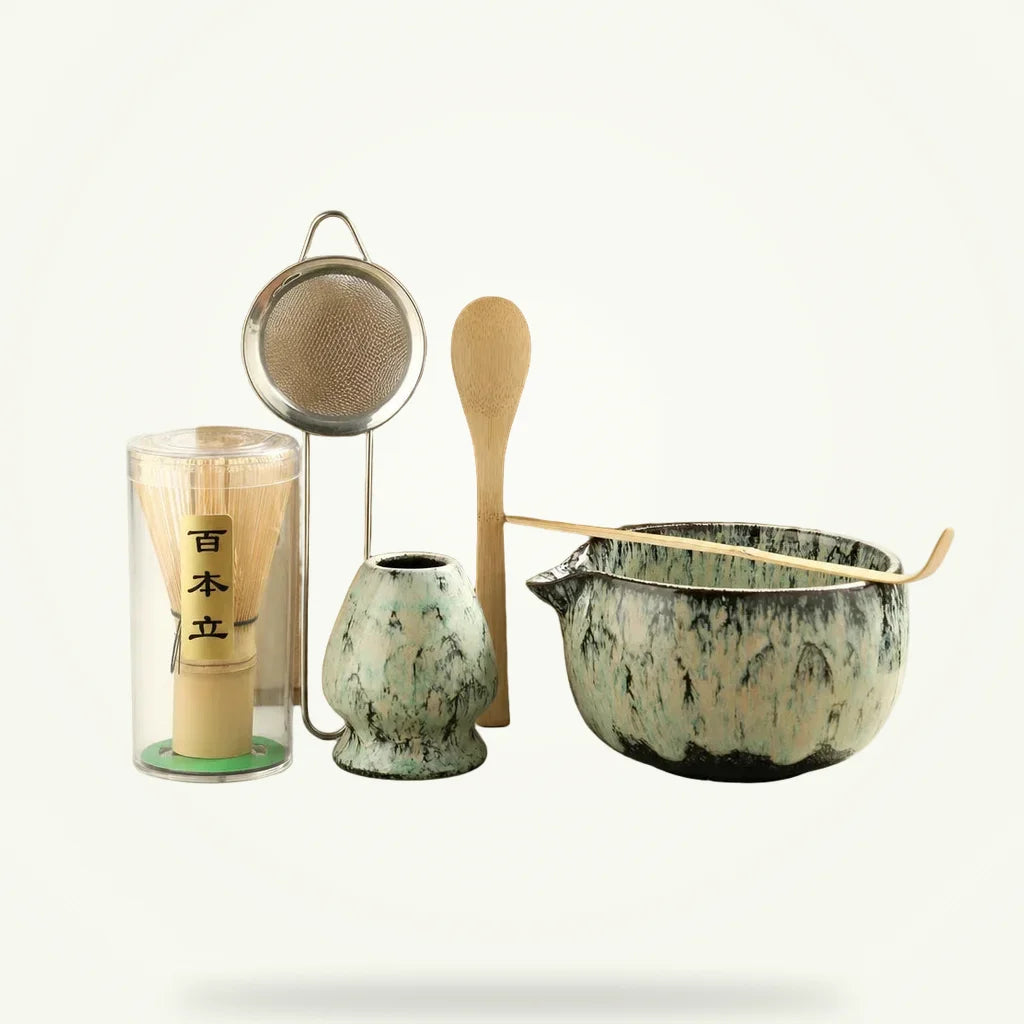 6-piece ceramic matcha tea set with bamboo whisk, scoops, and sifter on plain background