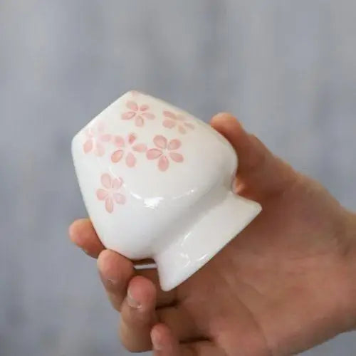 Sakura white porcelain chasen stand with bamboo whisk inserted