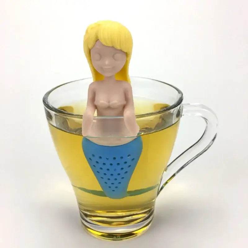 Yellow mermaid tea infuser hanging on a mug
