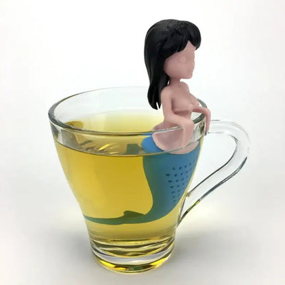 Black mermaid tea infuser on a cup of tea