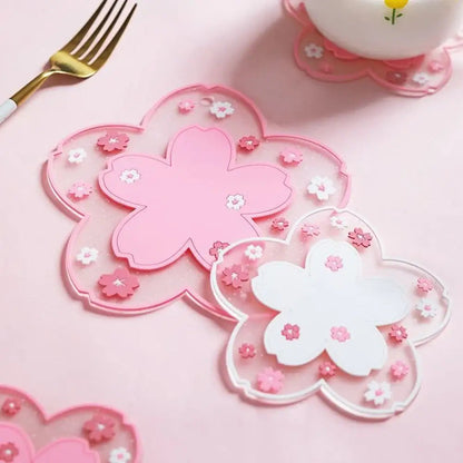 Pink floral tea coaster set on wooden table