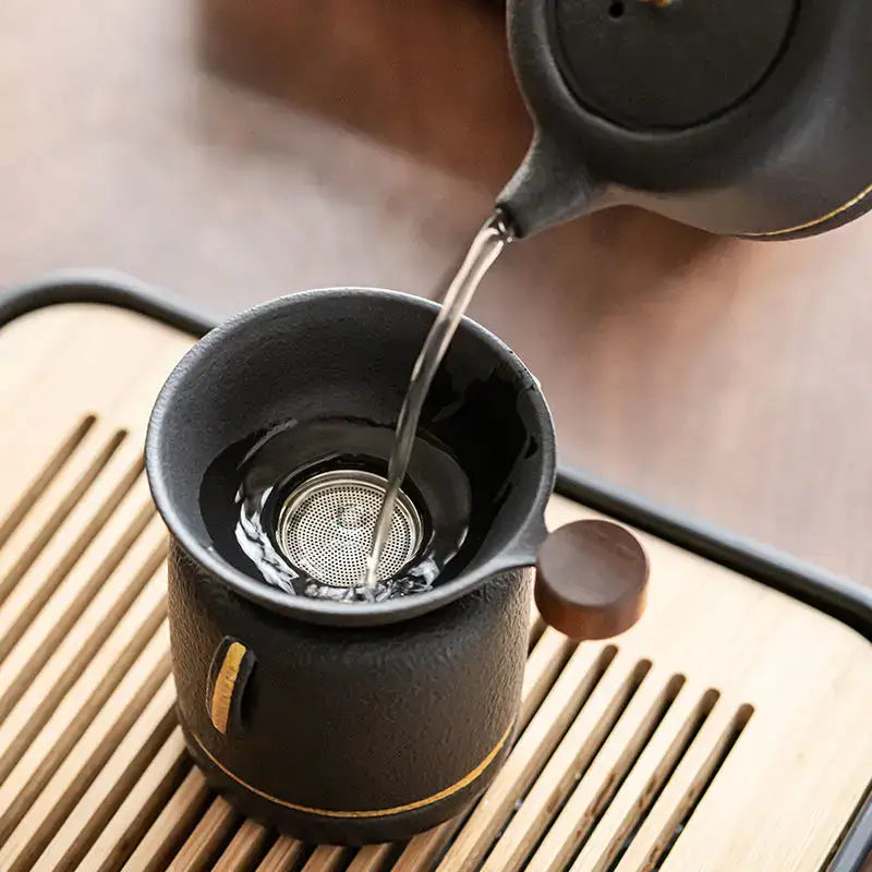Mini ceramic tea strainer for loose leaf tea on a mug