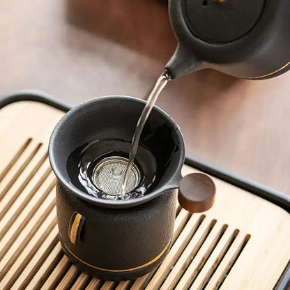 Mini ceramic tea strainer for loose leaf tea on a mug