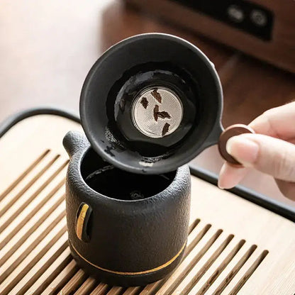 Close up of ceramic tea infuser strainer with tea leaves