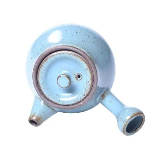 Top view of mini ceramic teapot with lid on