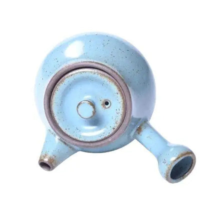 Top view of mini ceramic teapot with lid on