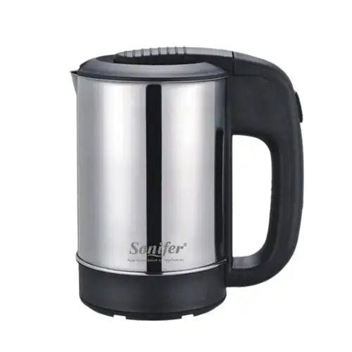 Cordless mini kettle pouring hot water into cup