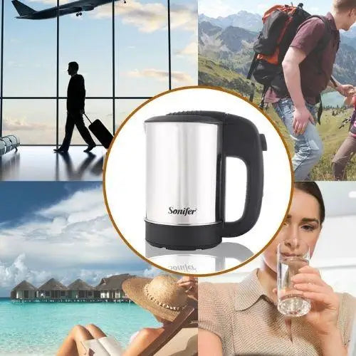 Mini kettle with cups on wooden table