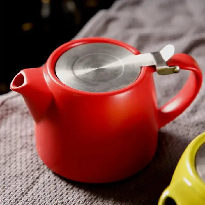 Red modern ceramic teapot with cup