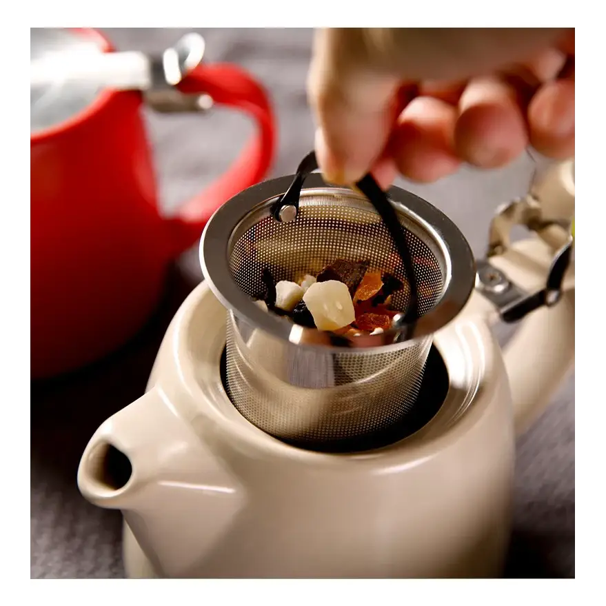 Modern ceramic teapot with steam rising