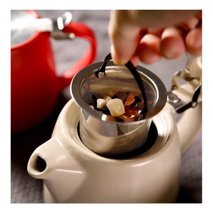 Modern ceramic teapot with steam rising