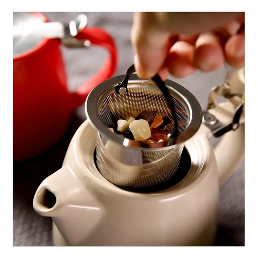 Modern ceramic teapot with steam rising