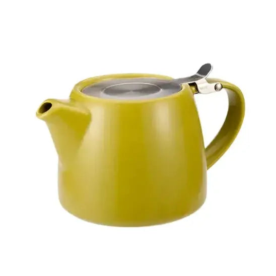 Yellow modern ceramic teapot with tea leaves
