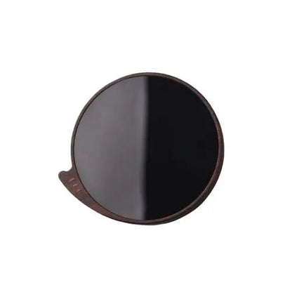 Brown cup warmer for tea with a cup of hot tea