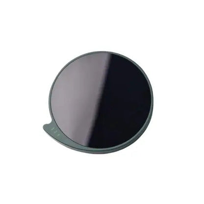 Dark green cup warmer for tea on a wooden table