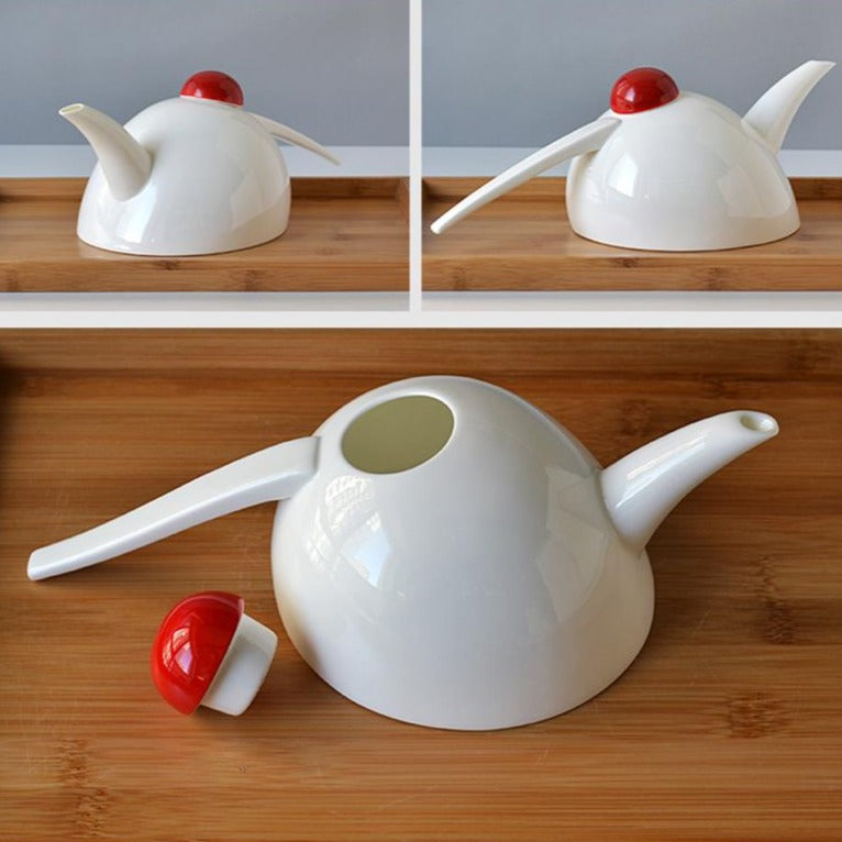 Close-up of Scandinavian porcelain teapot spout and fitted lid