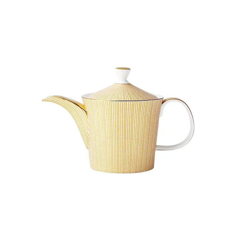 Yellow porcelain teapot set with cups and kettle