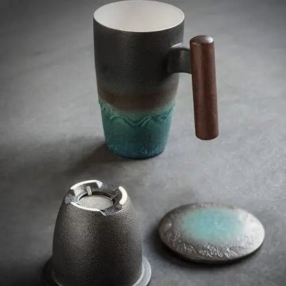 Ceramic tea pot for one placed on wooden surface, showing full profile with lid