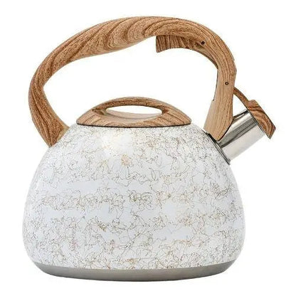 Whistling teapot with cream finish on table