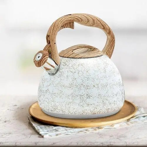 Elegant cream whistling teapot display