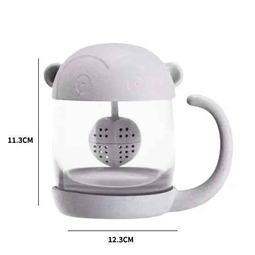 Size reference of monkey glass tea cup held in hand