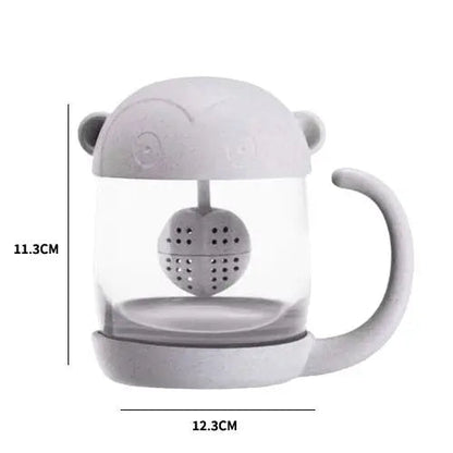 Size reference of monkey glass tea cup held in hand