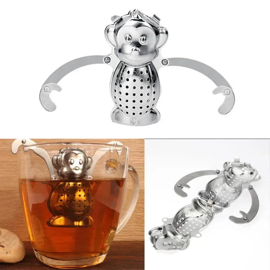 Monkey tea infuser with drip tray on a wooden table
