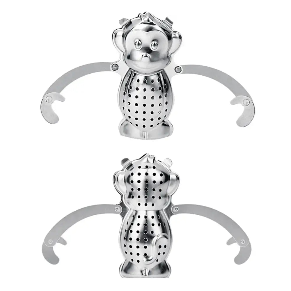 Monkey tea infuser with loose leaf tea nearby