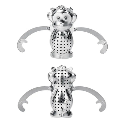Monkey tea infuser with loose leaf tea nearby