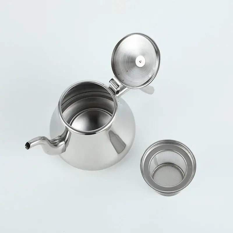 Moroccan stainless steel teapot heating water on induction cooktop