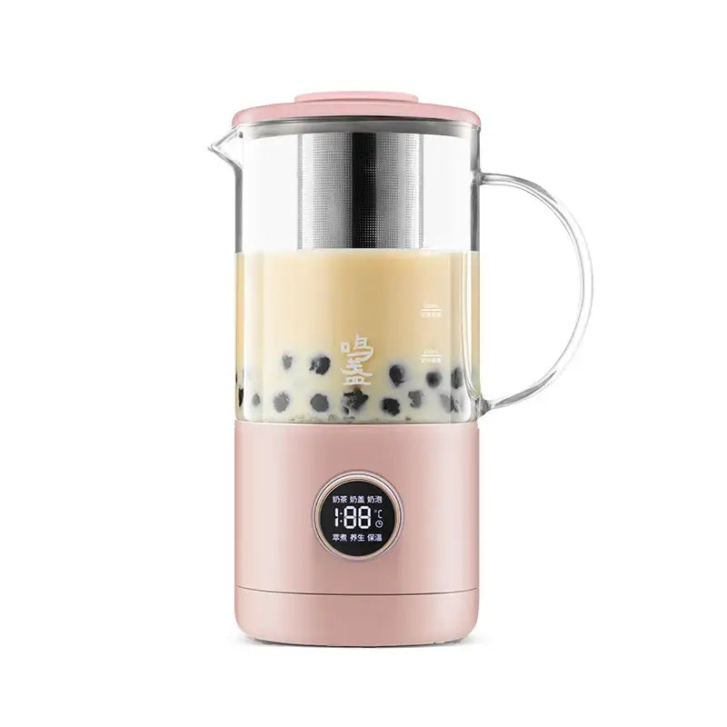 Multifunction tea maker 500ml in rose pink color on a light wood surface