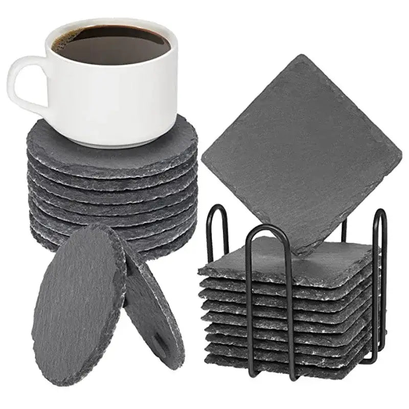 Slate coasters on wooden table
