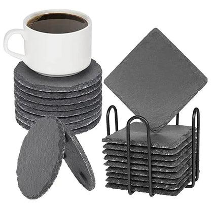 Slate coasters on wooden table