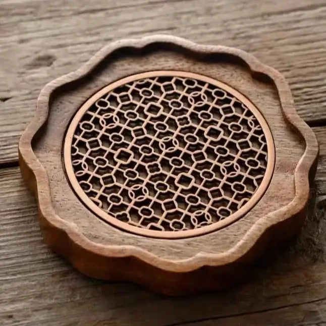 Wood teapot trivet protecting table surface from hot ceramic teapot