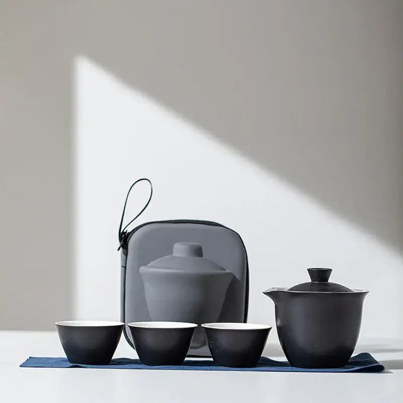 Black portable porcelain teapot set with two matching cups