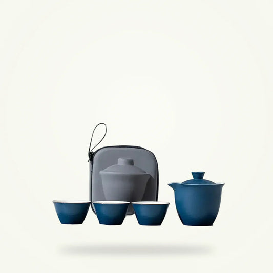 Portable porcelain travel teapot set with 2 cups, packshot on plain background