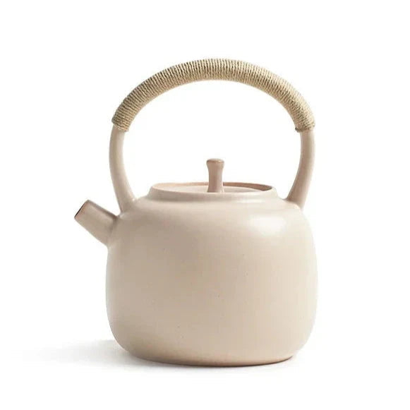 Cream Nordic ceramic teapot 750ml on a wooden table, natural light