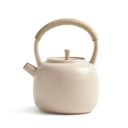 Cream Nordic ceramic teapot 750ml on a wooden table, natural light