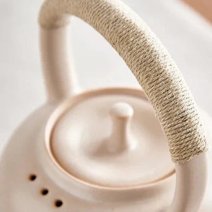 Red ceramic teapot 750ml with a matching red mug, side view