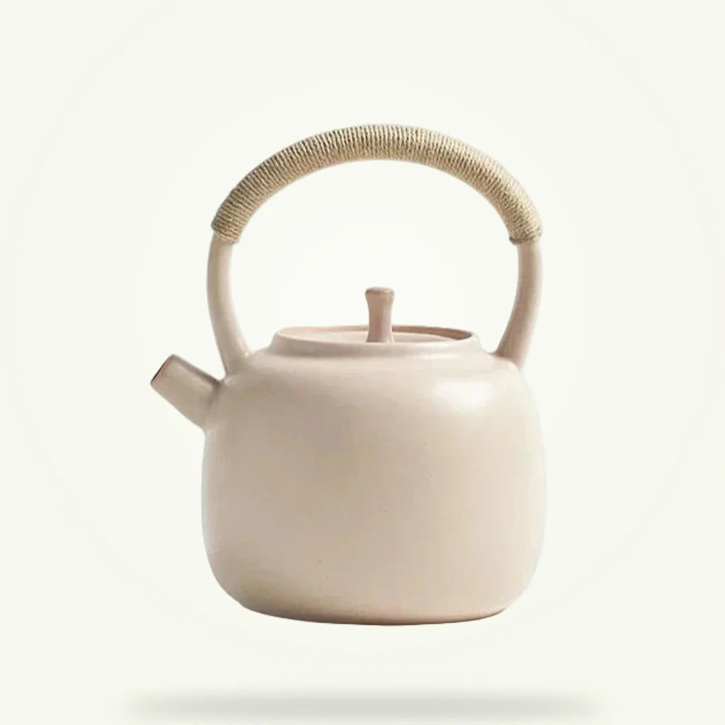 Nordic ceramic teapot 750ml in cream on a plain background, front view with lid