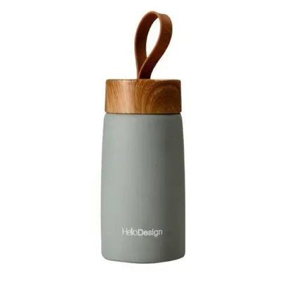 Green stainless steel insulated tea bottle with silicone grip